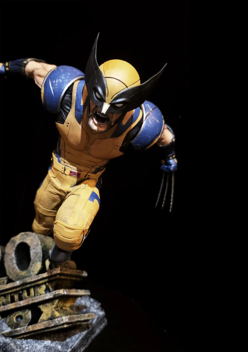 hand painted wolverine blue yellow suit statue